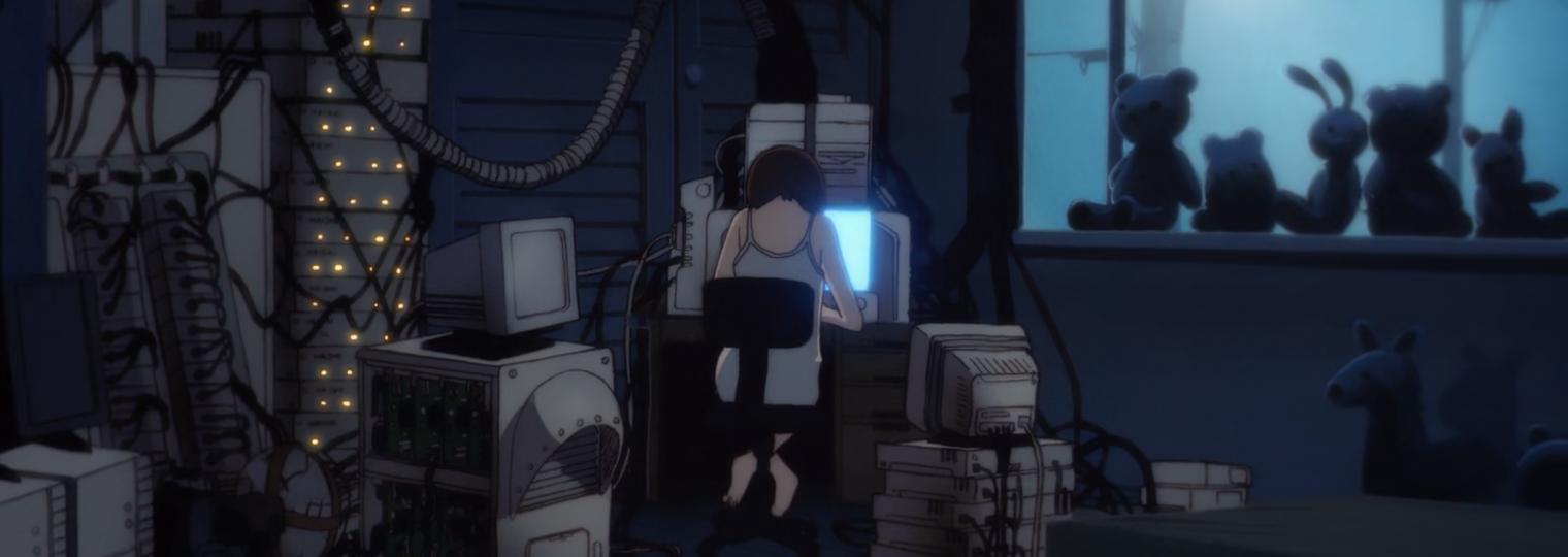 Lain sitting in front of computers